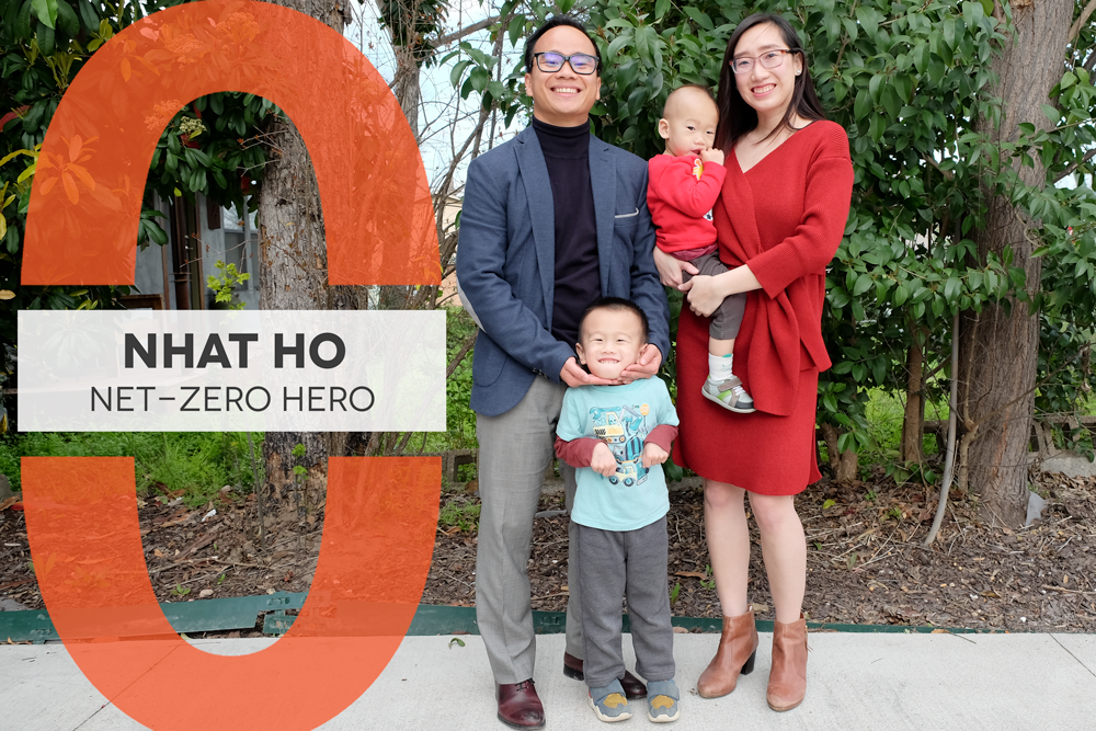Photo of a family of four in front of large green trees. Graphic reads "Nhat Ho Net-Zero Hero"